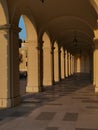 Sunny outdoor walkway with arches