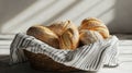 Artisan Sourdough Bread Loaves in a Wicker Basket with Striped Cloth, Natural Light Royalty Free Stock Photo