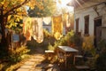 sunlit backyard with clothesline full of drying clothing Royalty Free Stock Photo