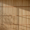 Sunlit Bamboo Wall Texture Background Royalty Free Stock Photo