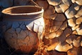 sunlit close-up of cracked clay pot during drying Royalty Free Stock Photo