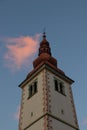 Sunlit cloud over church in Bitnje