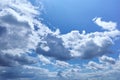 Sunlit cumulus humilis clouds in blue sky Royalty Free Stock Photo