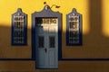 Sunlit facade of colorful colonial building in Merida, Yucatan, Mexico Royalty Free Stock Photo