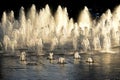 Sunlit fountain in a city centre Royalty Free Stock Photo