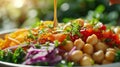 Sunlit Fresh Vegetable Chickpea Salad Drizzled with Dressing. Golden sunlight enhances a colorful chickpea salad adorned with a