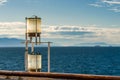 Sunlit glass and metal sternlight of ship. Stephen`s Passage, Alaska, USA. Royalty Free Stock Photo