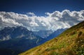 Sexten Dolomites from Carnic Alps sunlit flowered grassy slopes Royalty Free Stock Photo