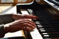 sunlit hands playing a morning melody on piano