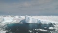 Sunlit icebergs in Antarctica ocean. Aerial.