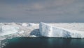 Sunlit icebergs in Antarctica ocean. Aerial shot.