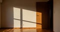 Interior Room with Sunlight Streaming Through Blinds Casting Shadows on Wall and Floor sunbeams Royalty Free Stock Photo