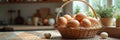 Sunlit kitchen with basket of brown eggs and rustic wooden counter Royalty Free Stock Photo