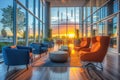 Sunlit lobby in an open plan corporate office building. Modern waiting area in the office lobby with glass walls, marble Royalty Free Stock Photo