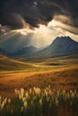 sunlit mountain landscape with dramatic clouds Royalty Free Stock Photo