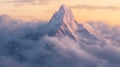 Sunlit mountain peak rising above clouds during serene sunrise. Tranquility concept Royalty Free Stock Photo