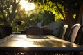 sunlit patio table with chairs tucked in