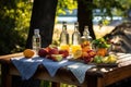 sunlit picnic table with infused vodka bottles and fresh fruits