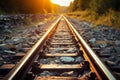 Sunlit railway track with ballast gravel, a scenic railroad landscape