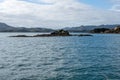 Sunlit seascape view with cloudy sky background, Bay of islands