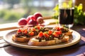 sunlit side view of tapenade bruschetta plate on breakfast table Royalty Free Stock Photo
