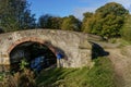 Sunlit Stone Arched Bridge Along a Popular Walk Next to Ripon Canal.