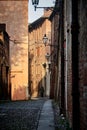 Woman walking in the historic center of Ferrara in Italy Royalty Free Stock Photo