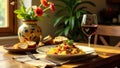 A sunlit table setting features a delectable pasta dish garnished with vibrant red berries, accompanied by crusty bread and a Royalty Free Stock Photo