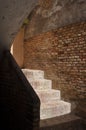 A Sunlit and Whitewashed Brick Stairwell Royalty Free Stock Photo