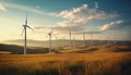 Sunlit wind turbines spin in row, powering sustainable growth generated by AI