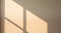 Sunlit Window Shadow on Wall Creating Geometric Pattern in Minimalist Interior Royalty Free Stock Photo