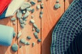 sunlit women's hat with sunscreen cream, towel and blue pebbles