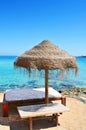 Sunlounger and umbrella in Ibiza, Spain