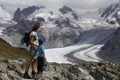 Sunnegga, Switzerland - August 15, 2018: Single parent family, mother and son, on their holidays at the edge of a mountain