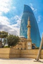 Sunni mosque against the background of Flaming Towers in Baku