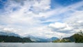 Sunning panoramic view of The island of Bled, Bled castle on cliff, Julian Alps and Church of the Assumption,Bled, Slovenia. Royalty Free Stock Photo