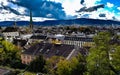 Sunny aerial zurich old town historic city centre university view over city church tower buildings trees background hill Royalty Free Stock Photo