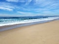 Sunny afternoon on beach with light clouds Royalty Free Stock Photo