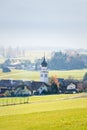 Austrian mountain village with misty valley background during autumn in Wildermieming, Tirol, Austria Royalty Free Stock Photo