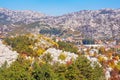 Sunny autumn day in mountains. Beautiful mountain landscape. Montenegro, Dinaric Alps, Cetinje town in distance Royalty Free Stock Photo