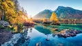 Sunny autumn view of Hintersee lake with Hochkalter peak on background, Germany, Europe. Spectacular morning view of Bavarian Alps