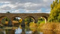 Sunny autumn view of the historic old stone bridge in richmond, tasmania Royalty Free Stock Photo