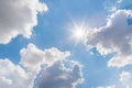 Sunny background, blue sky with white clouds and sun Royalty Free Stock Photo