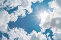 Sunny background, blue sky with white clouds and sun. The natural blue background has a breeze on a bright day in the summer Royalty Free Stock Photo
