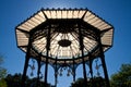 Sunny backlit Bandstand with glass ceiling and wrought iron frame