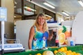 A happy street vendor sells assorted fruit juice