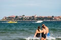 Sunny Beach, Bulgaria July 13, 2019. Inflatable recreational banana boat with people towed by a motorboat in the Black Sea on the