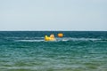 Sunny Beach, Bulgaria July 13, 2019. Inflatable recreational banana boat with people towed by a motorboat in the Black Sea on the