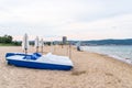 Sunny Beach, Bulgaria July 13, 2019. Two pedal boats standing on the shore, both folded umbrellas in Sunny Beach, Bulgaria. In the