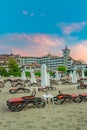 Sunny Beach, Bulgaria - 4 Sep 2018: Umbrellas and chair lounges at sunrise in Sunny Beach, a major seaside resort on the Black Sea